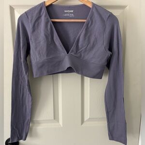 Garage clothing store purple cropped long sleeve v shaped ribbed top